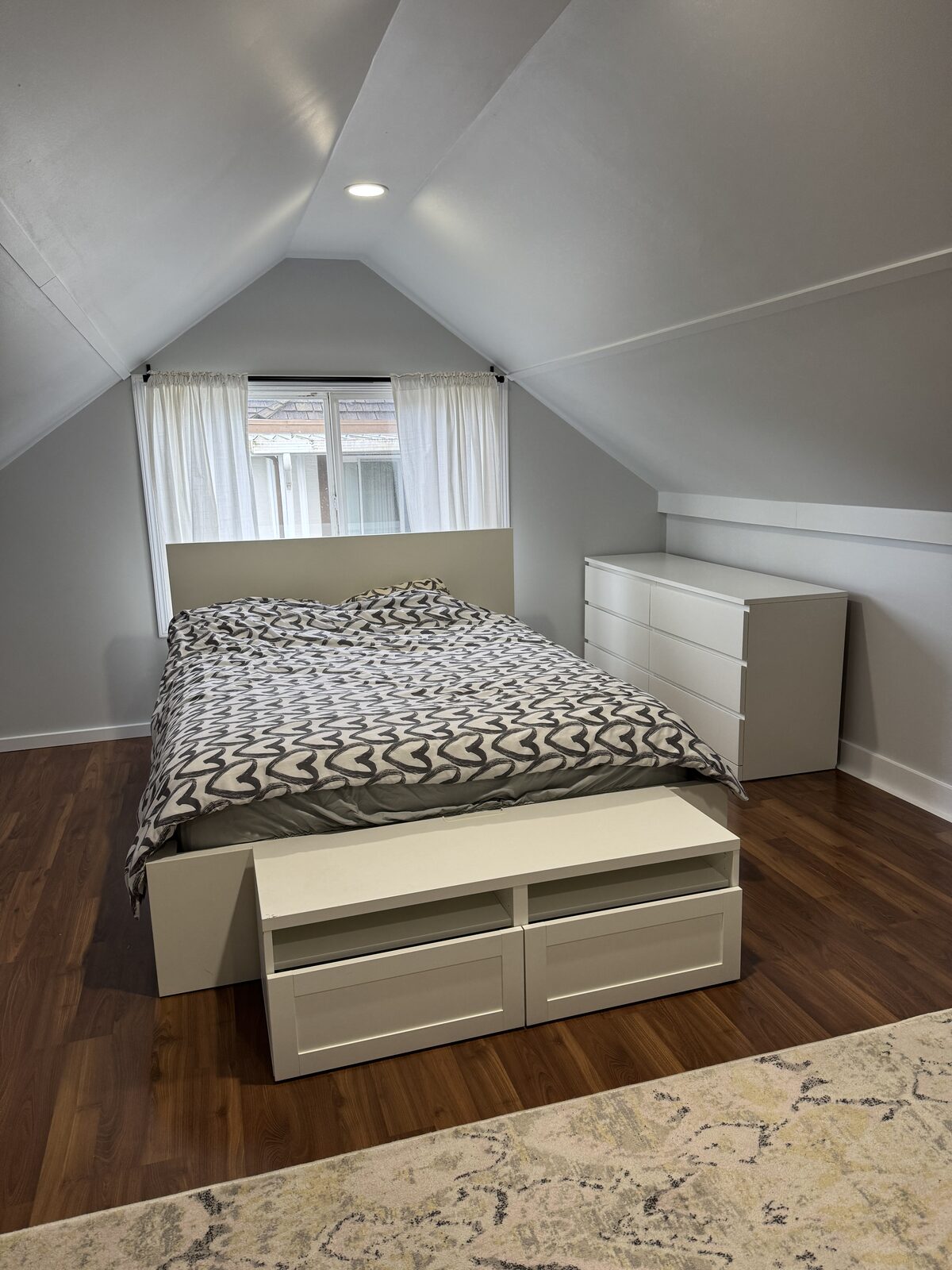 Upper bedroom with vaulted ceiling